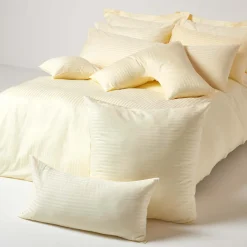 Homescapes Taie d'oreiller jaune pastel satin rayé en coton égyptien 330 fils, 40x80 cm -