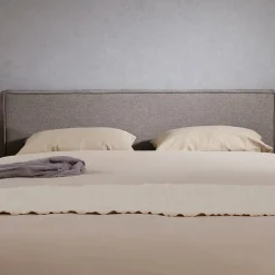 Idimex Tête de lit KLAO 160 sur pieds, en tissu - Gris